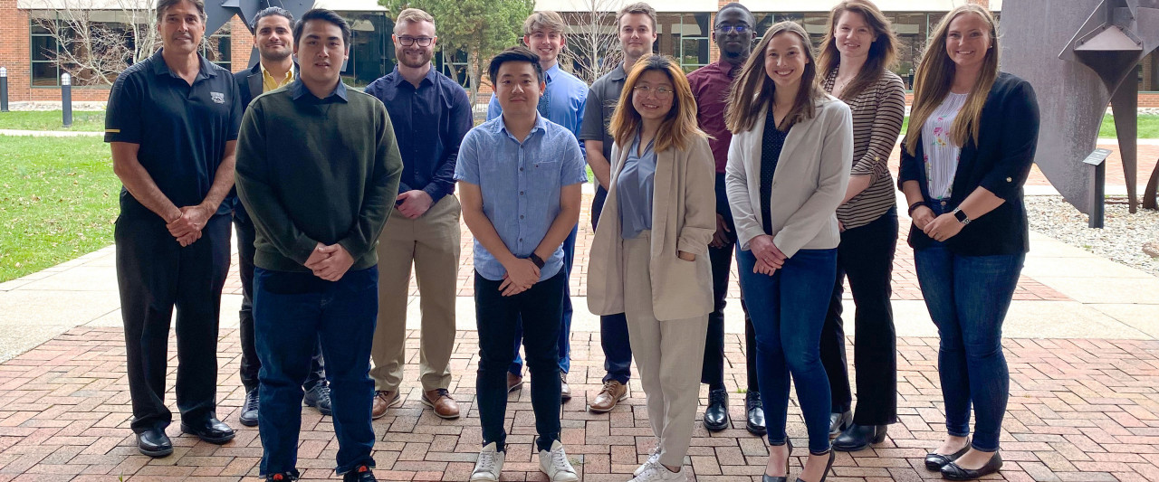 Dr. Sime Curkovic and supply chain students who worked with Fusion Management Partners stand outside in the Haworth College of Business courtyard.
