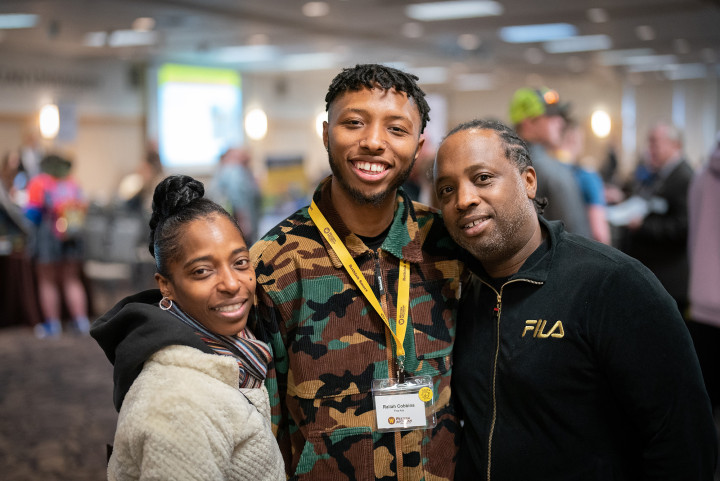 Parents with their son at an admitted student event.