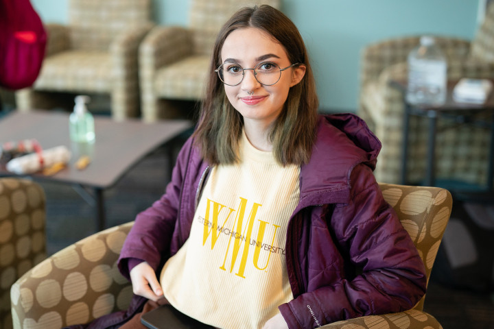 student in study lounge wearing WMU shirt