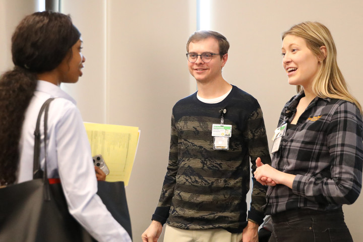 WMU student meeting with local employers during an event on campus.