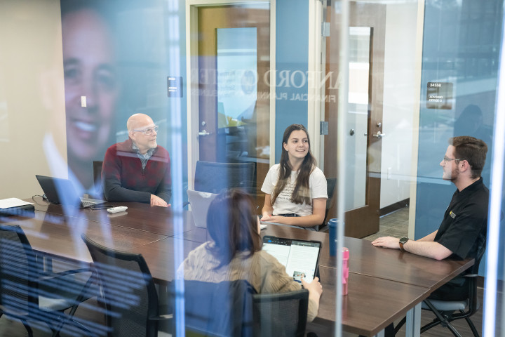 A group of students are working in the Sanford Center for Financial Planning and Wellness.