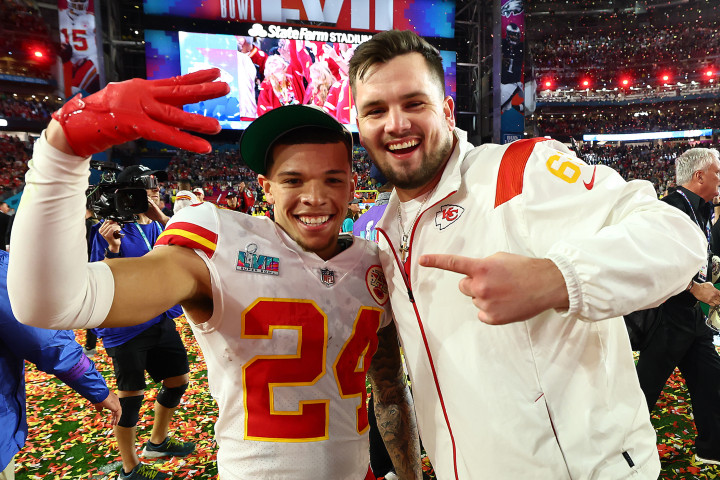 Skyy Moore and Mike Caliendo celebrate on the field after their Super Bowl victory. Photo credit Steve Sanders, Kansas City Chiefs. 
