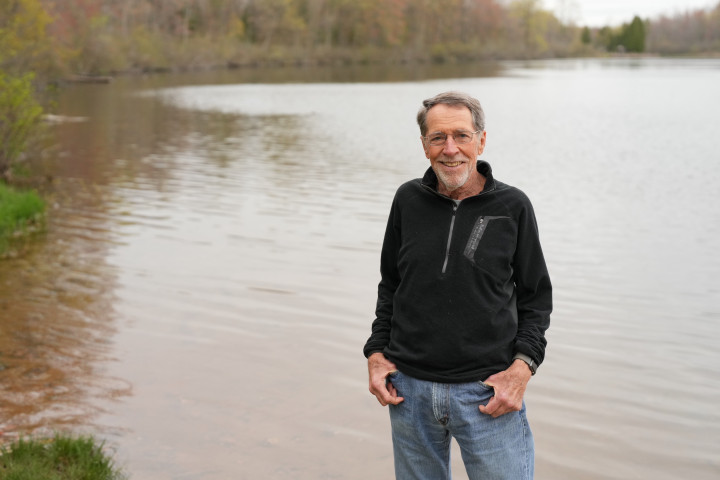 David Sluyter standing at Wolf Lake.