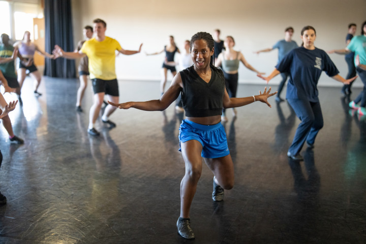 Students dancing in rehearsal.