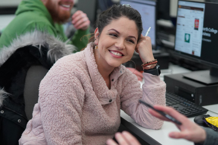 Woman smiling in computing lab