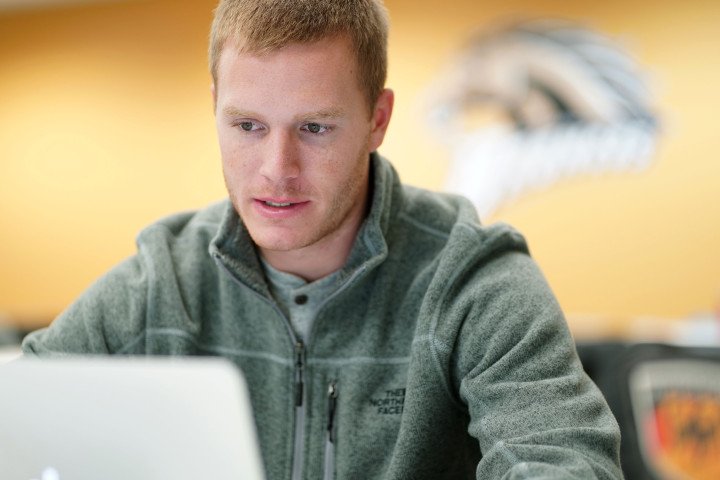 Student looking intently at computer screen