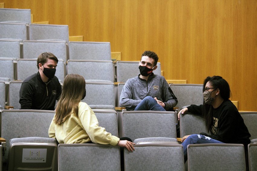 digital marketing student coordinators sitting in auditorium