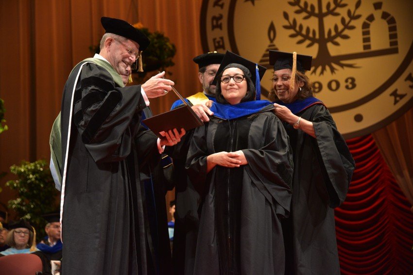 Ph.D. student receiving diploma