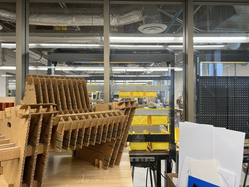 The prototyping lab featuring a cardboard chair design and some materials.