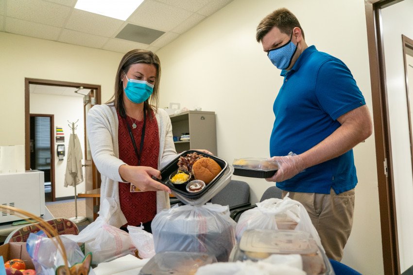 Director of Nursing Jessica Slates displays a plate of donated food.