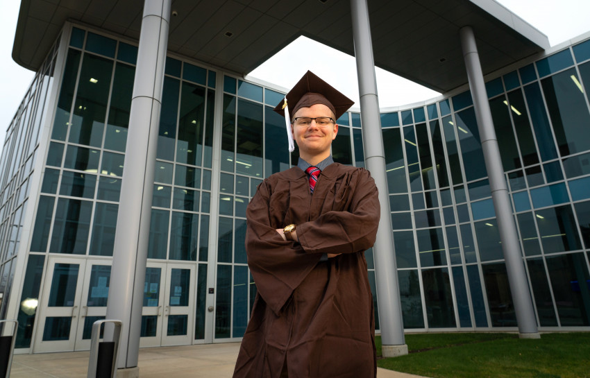 A photo of Michael Sekich in his cap and gown.