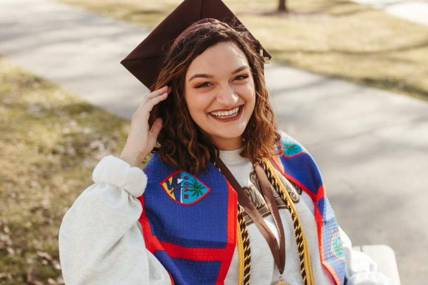 A photo of Alyssa Zamora in her graduation regalia.