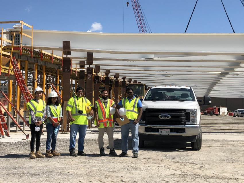 A group photo at a construction site.