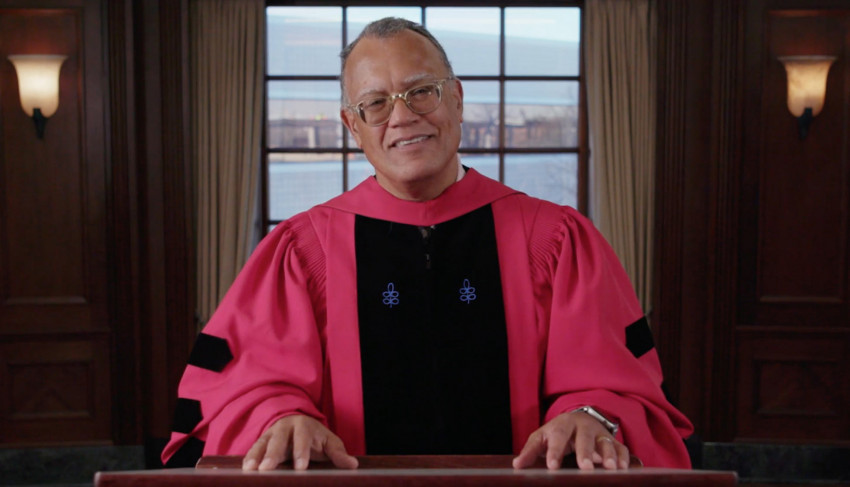 President Montgomery smiling in his graduation regalia.