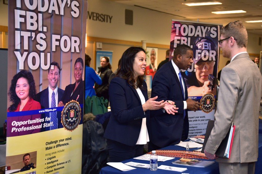 Students talking with FBI recruiters.