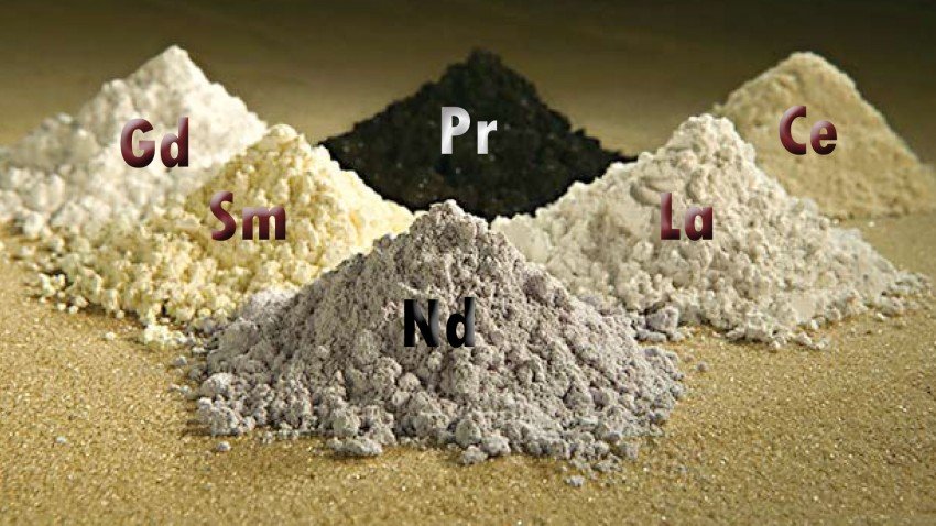 Six small mounds of different colored powders.