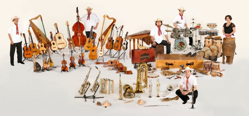 The six ensemble members surrounded by instruments.