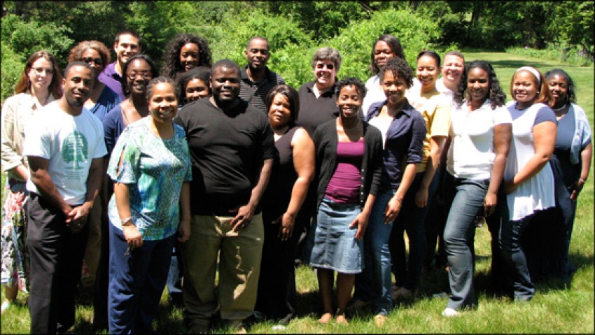 Sixteen doctoral students pose with event facilitator Dr. Wendy Carter-Veale, the Dean of the WMU Graduate College, Dr. Susan Stapleton, Director of Graduate Student Recruitment and Retention Mr. Tony Dennis, and a representative from Michigan State in the beautiful natural surroundings of the Kellogg Biological Station. The sun is shining brightly, it was a very hot day.