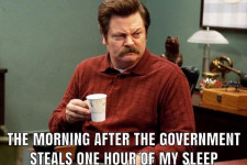 Popular RV character Ron Swanson with a caption that reads "the morning after the government steals one hour of my sleep."