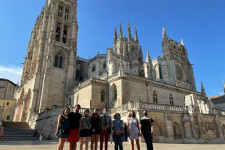 Group of of students standing in front of Spanish cathedral.