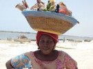 Photo of African woman carrying items in her hat