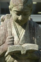 Photo of girl studying, a statue